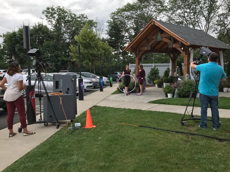 Behind the scenes of Cori Magnotta and Heidi Voight filming a news segment